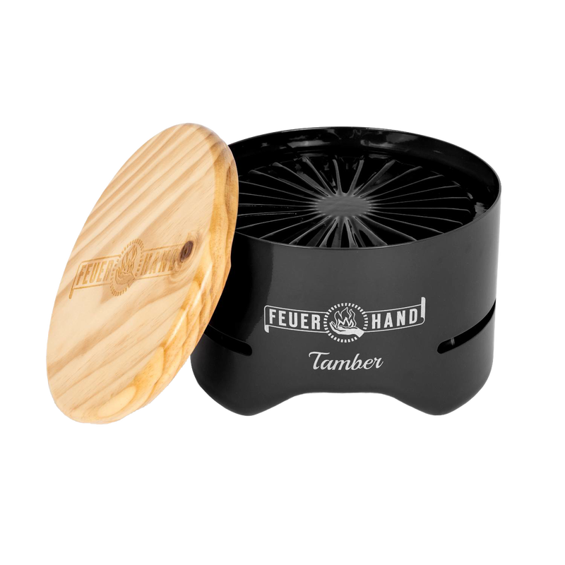 Compact black tabletop charcoal grill with a handcrafted wooden lid engraved with logo, designed for small outdoor cooking in Farm, Garden & Tool and Camping collections.