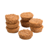 Eight handcrafted Fatwood Firedrops made from natural sawdust and paraffin, arranged in small stacked piles, perfect for camping, emergency supplies, and outdoor fire-starting.