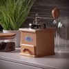 Handcrafted wooden coffee grinder with metal top and wooden crank handle, featured in Farm, Garden & Tool, Kitchen & Food, Brewing Coffee and Tea, Best Sellers, and Homesteading collections.