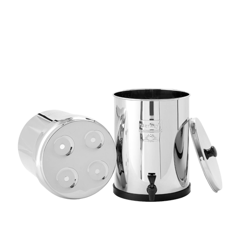 Polished stainless steel water filter with removable lid and base chamber featuring four filter element openings and a black spigot, suitable for Appliances and Emergency Supplies collections.