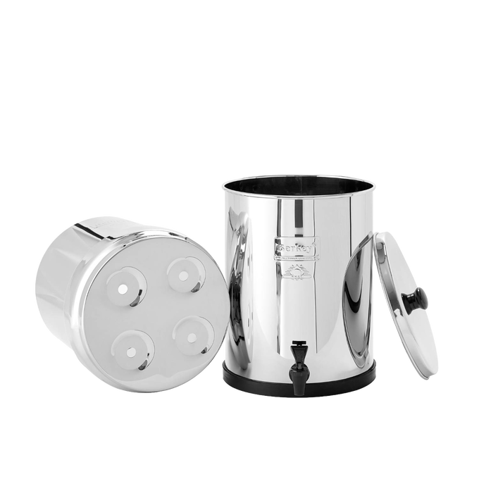 Polished stainless steel water filter with removable lid and base chamber featuring four filter element openings and a black spigot, suitable for Appliances and Emergency Supplies collections.