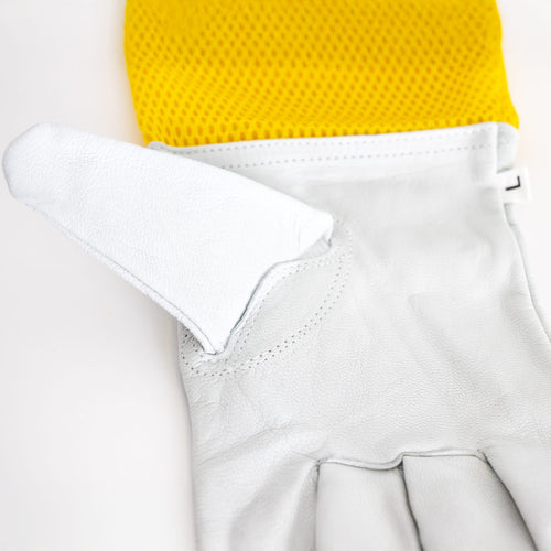 Close-up of a smooth goatskin beekeeping glove showing a yellow vented fabric cuff with elastic opening, designed for protection and dexterity in farm, garden, and beekeeping tasks.