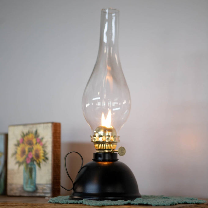 Handcrafted oil lamp with a black steel round font, curved handle, clear glass chimney, and brass burner, ideal for Farm, Garden & Tool, Emergency Supplies, and Best Sellers collections.