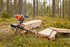Portable timber cutting setup with guide rails clamped to a log outdoors, designed for precise plank milling in Farm, Garden & Tool and Wood Cutting and Hauling collections.