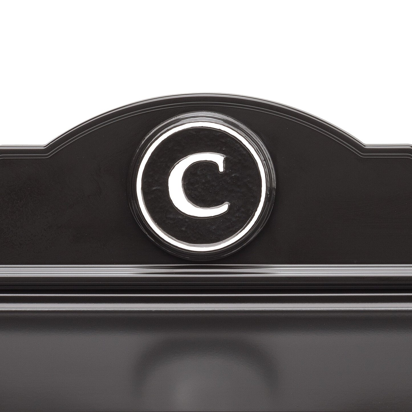 Close-up of a handcrafted black and white custom wall mount mailbox featuring a raised circular monogram letter "C," designed to enhance curb appeal in Home & Decor and USA Made collections.