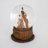 Miniature handcrafted snow globe featuring hand-painted figurines of the Holy Family inside a clear glass dome with a detailed wood-textured base, ideal for holiday decor collections.