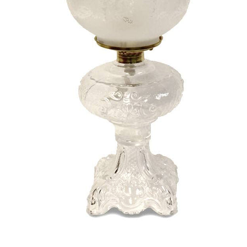 Handcrafted clear glass oil lamp featuring an intricately sculptured base and a heavy brass-plated burner, topped with a frosted etched chimney, ideal for Lamps & Lighting, Oil Lamps, Table Lamps, Best Sellers, and Promo Eligible collections.