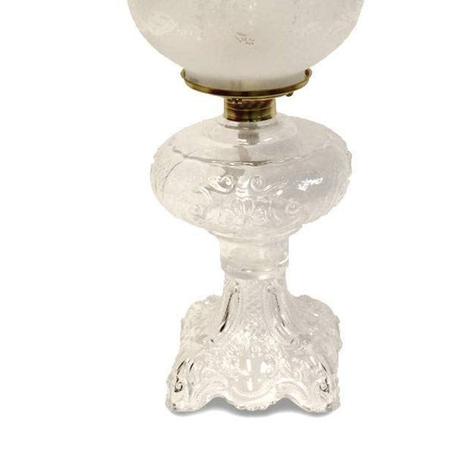 Handcrafted clear glass oil lamp featuring an intricately sculptured base and a heavy brass-plated burner, topped with a frosted etched chimney, ideal for Lamps & Lighting, Oil Lamps, Table Lamps, Best Sellers, and Promo Eligible collections.