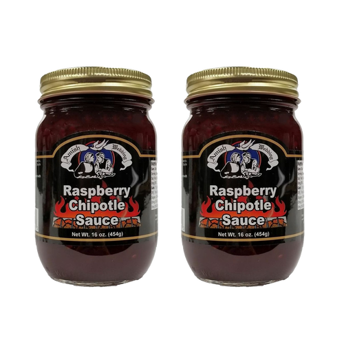 Two handcrafted glass jars of raspberry chipotle sauce with gold lids, featuring a black label with fiery design, made in USA, ideal for Kitchen & Food, Pantry, and Best Sellers collections.