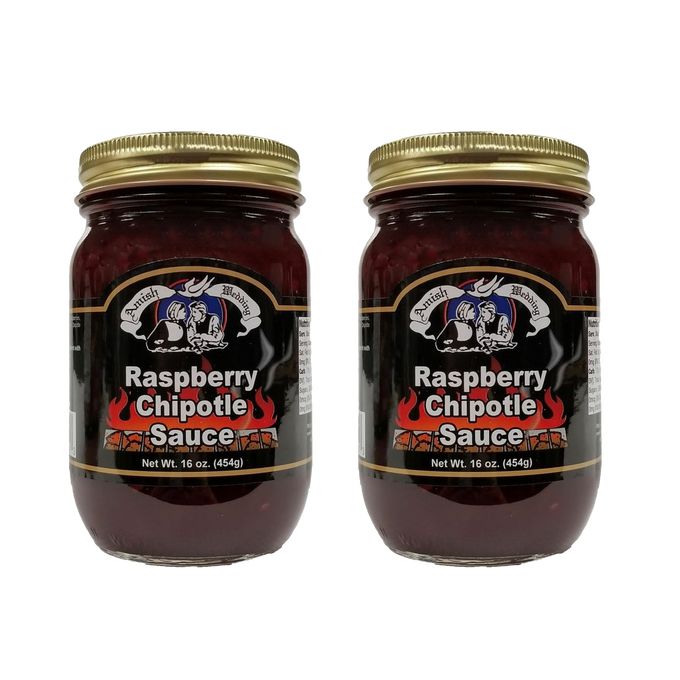 Two handcrafted glass jars of raspberry chipotle sauce with gold lids, featuring a black label with fiery design, made in USA, ideal for Kitchen & Food, Pantry, and Best Sellers collections.