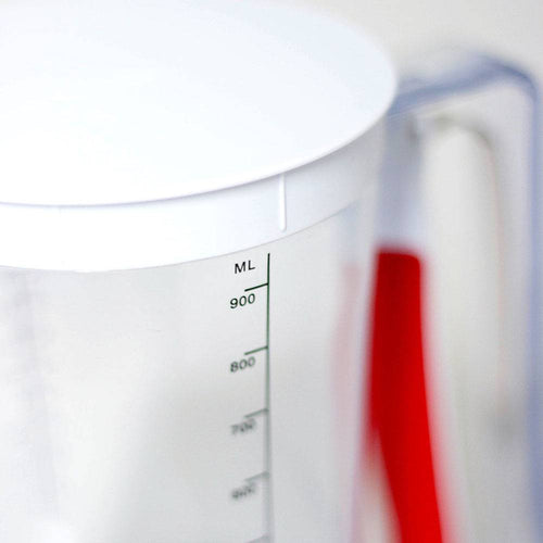 Clear plastic batter dispenser with white lid and red soft-grip handle, marked with milliliter measurements up to 900 ml, featured in Kitchen & Food, Kitchen Gadgets, Cooking and Baking Helpers, and Best Sellers collections.