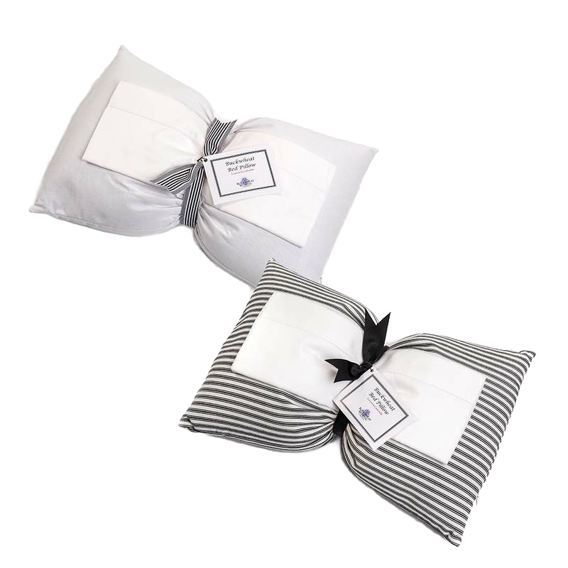 Two handcrafted buckwheat bed pillows with hypoallergenic covers, one in solid white and the other in striped fabric, part of Home & Decor, Home Textiles, USA Made, and Best Sellers collections.
