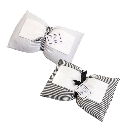 Two handcrafted buckwheat bed pillows with hypoallergenic covers, one in solid white and the other in striped fabric, part of Home & Decor, Home Textiles, USA Made, and Best Sellers collections.