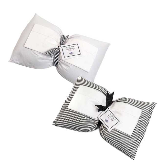 Two handcrafted buckwheat bed pillows with hypoallergenic covers, one in solid white and the other in striped fabric, part of Home & Decor, Home Textiles, USA Made, and Best Sellers collections.