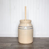 Handcrafted stoneware butter churn in natural stone color with smooth unfinished wooden dasher and classic double blue stripe, made in USA, ideal for Kitchen & Food and Specialty Equipment collections.