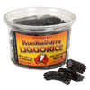 Clear plastic tub of handcrafted Australian black licorice with rich, chewy texture and several pieces of old-fashioned black licorice beside it, featured in Kitchen & Food, Snacks and Sweets, Candy, Best Sellers, and Promo Eligible collections.