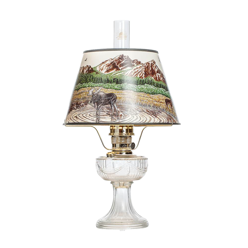 Clear glass oil lamp with brass burner and scenic Rocky Mountain parchment shade depicting wildlife and nature, featured in Lamps & Lighting, Oil Lamps, Table Lamps, Best Sellers, Promo Eligible collections.
