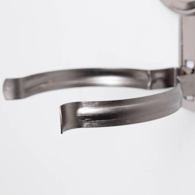 Close-up of a sturdy, painted pewter-like metal bracket arm from a handcrafted woodshed wall mounted oil lamp, part of lamps & lighting and oil lamps collections.