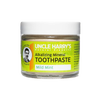 Glass jar of handcrafted all-natural alkalizing mint toothpaste with mineral clay and sea salt, featured in Health & Wellness, Grooming, and USA Made collections.