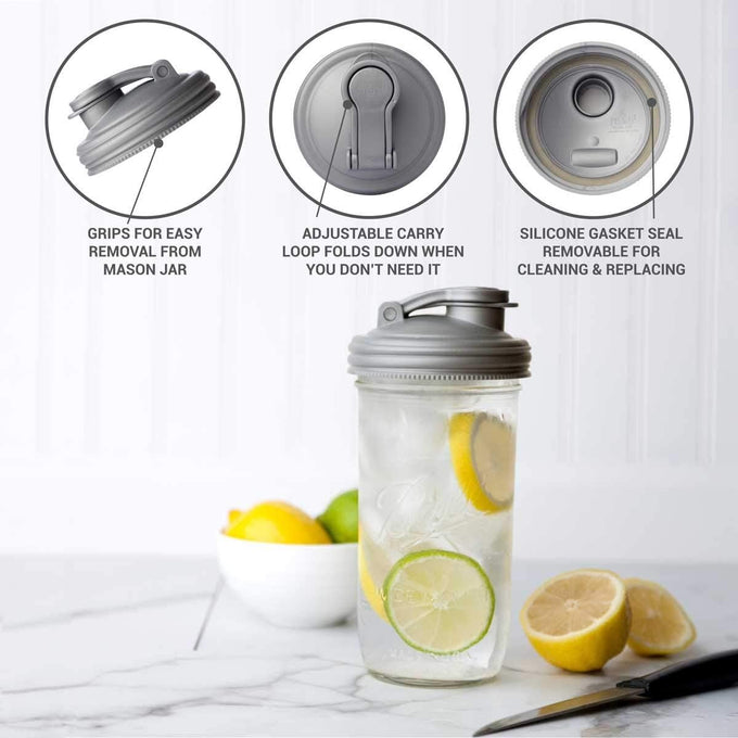 Gray no-break pour lid with flip-top spout and adjustable carry loop, featuring a removable silicone gasket, shown on a glass jar with lemon and lime slices, highlighting USA-made kitchen accessories in Kitchen & Food, Dinnerware, Kitchen Gadgets, Kitchen Accessories, Best Sellers, and Promo Eligible collections.