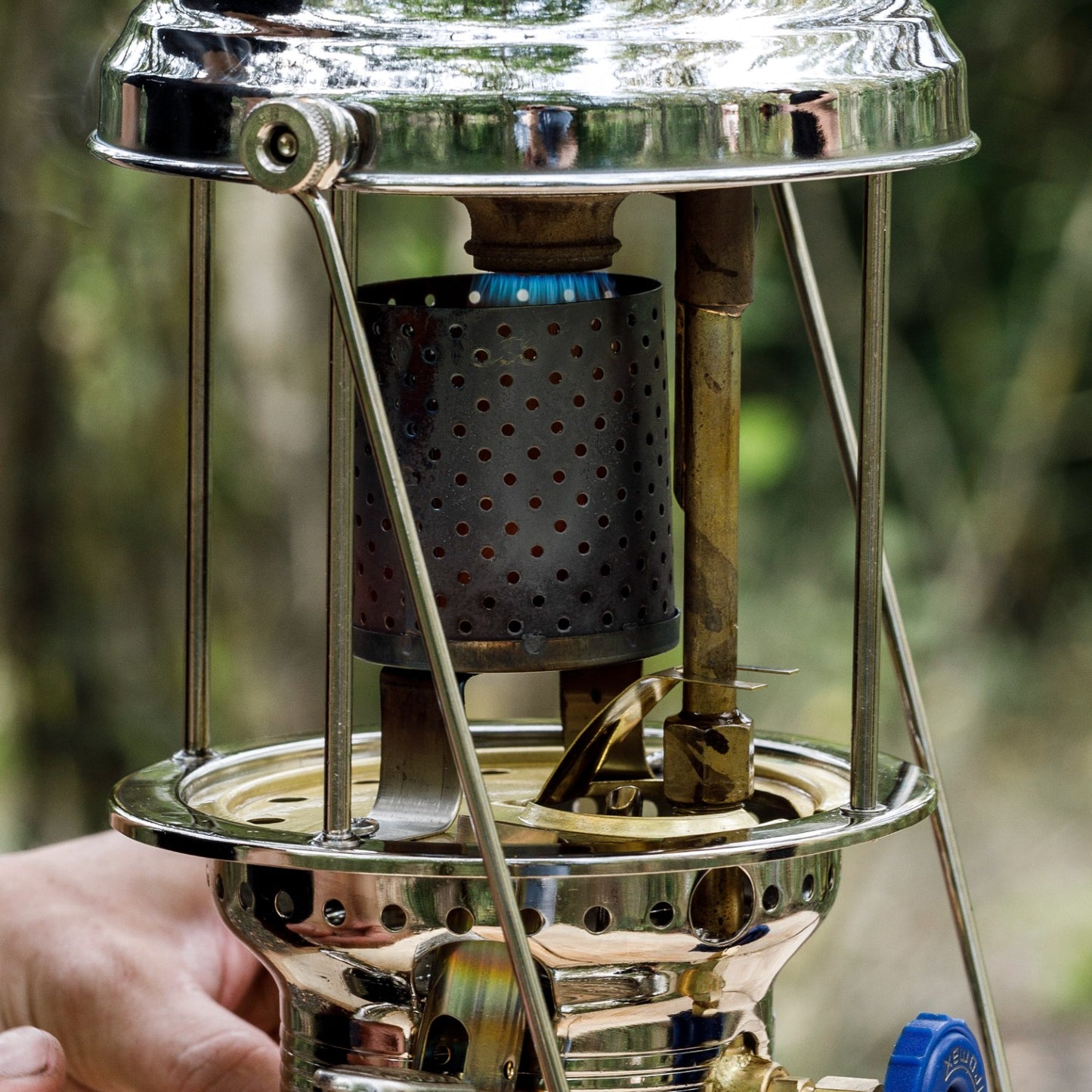 Close-up of a stainless steel radiator mounted on a vintage-style lamp burner, designed to convert the lamp into a heater, featured in Lamps & Lighting and Parts and Accessories collections.