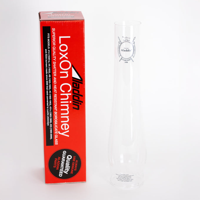 Clear glass oil lamp chimney with printed logo, shown beside tall red box labeled for shatter resistance and heat durability, suitable for Lamps & Lighting, Chimneys and Globes, Parts and Accessories, Best Sellers, and Promo Eligible collections.