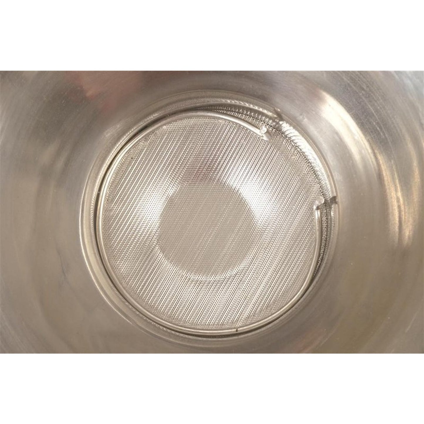 Close-up view of a fine mesh stainless steel strainer screen inside a large durable milk strainer, handcrafted for Farm, Garden & Tool, Animal Care, Best Sellers, and Promo Eligible collections.