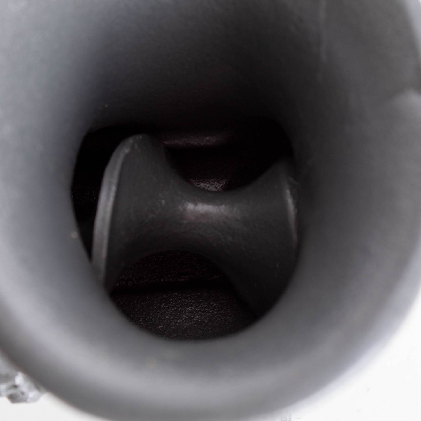 Close-up view inside the feed tube of a heavy-duty bolt-down meat grinder showing the rotating auger, part of a professional-grade kitchen and butchering tool made in the USA, featured in Kitchen & Food, Specialty Equipment, Butchering Supplies, USA Made, Best Sellers, and Promo Eligible collections.