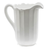 Handcrafted USA-made glass pitcher with a thick handle and fluted milk glass body, ideal for Kitchen & Food, Dinnerware, Storage and Serving, and Best Sellers collections.