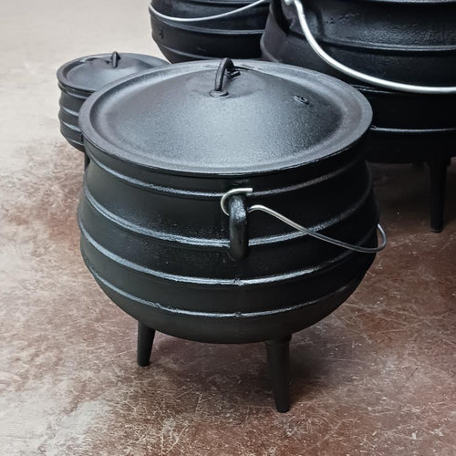 Handcrafted cast iron campfire kettle with distinctive round shape, three sturdy legs, and wire bail handle, designed for durable outdoor cooking in Farm, Garden & Tool, Camping, Best Sellers, Promo Eligible collections.