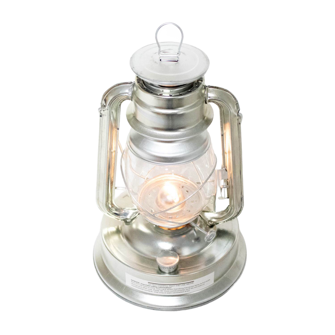 Vintage-style silver metal oil lantern with clear glass globe and lit flame, designed for outdoor use in Farm, Garden & Tool, Camping, Emergency Supplies, and Pest Control collections.