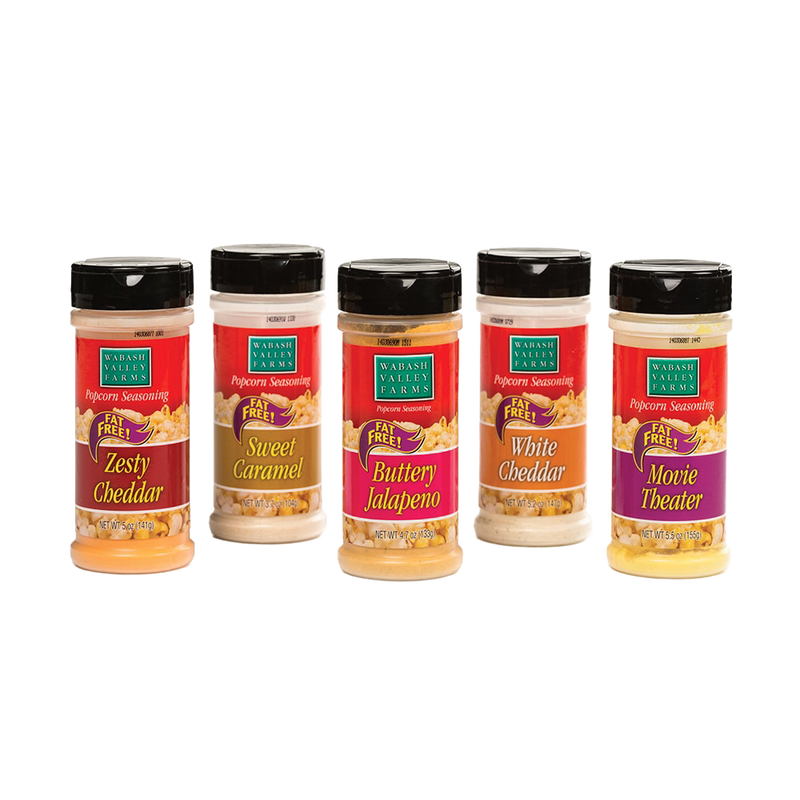 Five jars of handcrafted popcorn seasonings in flavors including Zesty Cheddar, Sweet Caramel, Buttery Jalapeno, White Cheddar, and Movie Theater, featured in Kitchen & Food and USA Made collections.