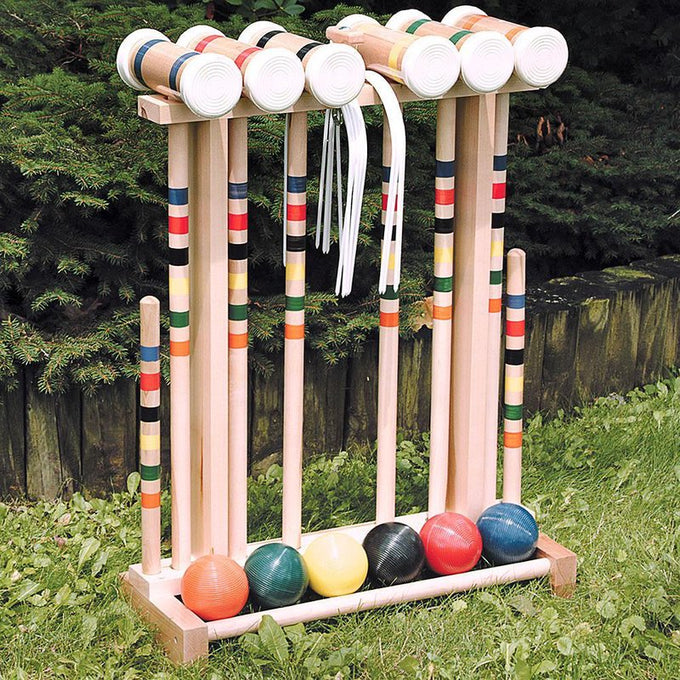 Handcrafted Amish-made maple croquet set with colorful striped mallets, balls, and wickets on wooden stand, ideal for outdoor play, lawn games, and children's toys collections.
