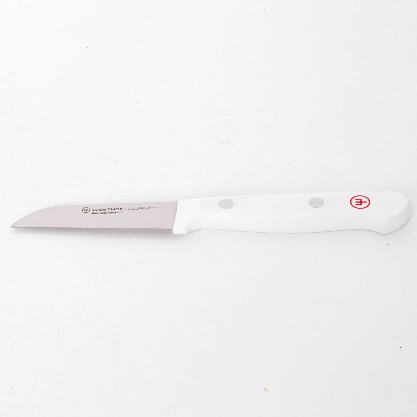 Kitchen paring knife with a stainless steel blade and ergonomic white handle, part of a 16-piece Wusthof Gourmet set designed for Food Prep, Kitchen Knives, and Farm, Garden & Tool collections.