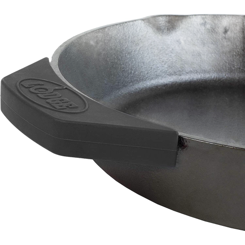 Black silicone assist handle holder fitted onto a cast iron skillet handle, protecting hands from heat up to 450°F, ideal for Kitchen & Food, Cookware, Cast Iron, Best Sellers, and Promo Eligible collections.