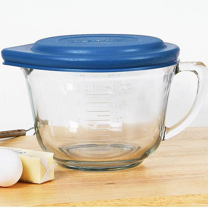 Clear thick-walled glass mixing bowl with a blue lid and handle, featuring embossed measurement marks, designed for Kitchen & Food, Cookware, Baking Supplies, Storage and Serving, USA Made collections.