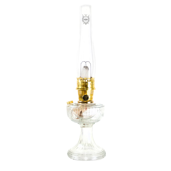 Handcrafted clear glass oil lamp with polished brass burner and tall chimney, made in USA, featured in Lamps & Lighting, Oil Lamps, Table Lamps, Best Sellers, and Promo Eligible collections.