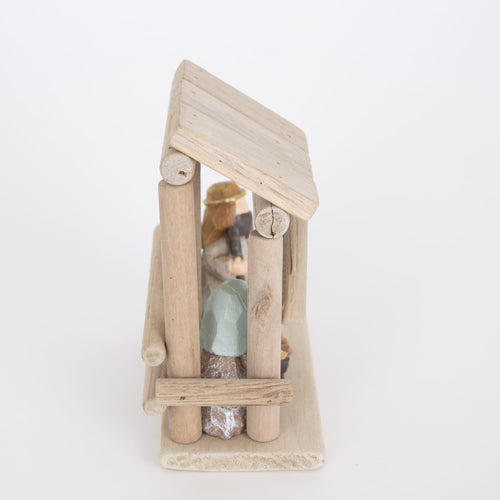 Handcrafted small nativity display featuring a simple wooden stable with attached resin Holy Family figurines, designed for Home & Decor, Holiday Decor, Best Sellers, and Promo Eligible collections.
