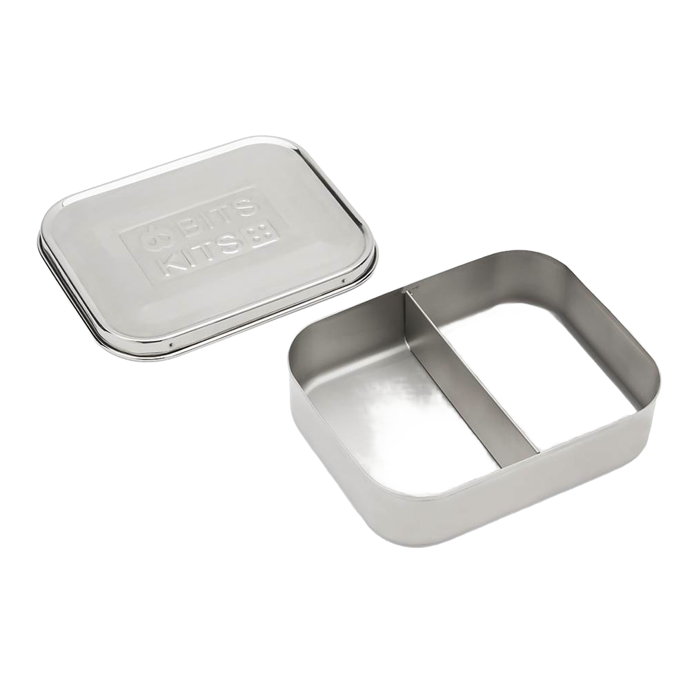 Open stainless steel snack container with two compartments and a separate lid, designed for organized food storage, featured in Kitchen & Food and Storage collections.