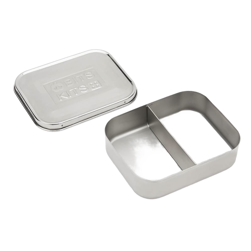 Open stainless steel snack container with two compartments and a separate lid, designed for organized food storage, featured in Kitchen & Food and Storage collections.