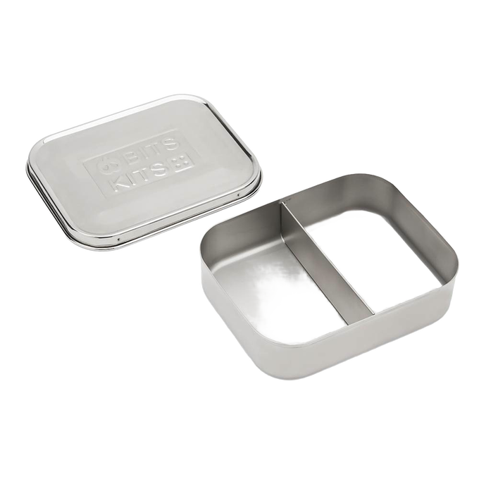 Open stainless steel snack container with two compartments and a separate lid, designed for organized food storage, featured in Kitchen & Food and Storage collections.