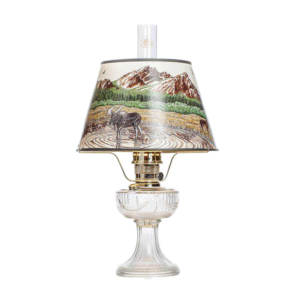 Clear glass oil lamp with brass burner and scenic Rocky Mountain parchment shade featuring wildlife and mountain landscape, perfect for Lamps & Lighting, Oil Lamps, Table Lamps, Best Sellers, and Promo Eligible collections.