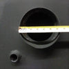 Close-up of a black welded steel water heater pipe opening measured with a tape, showcasing the sturdy construction of this handcrafted Amish made appliance from the USA.