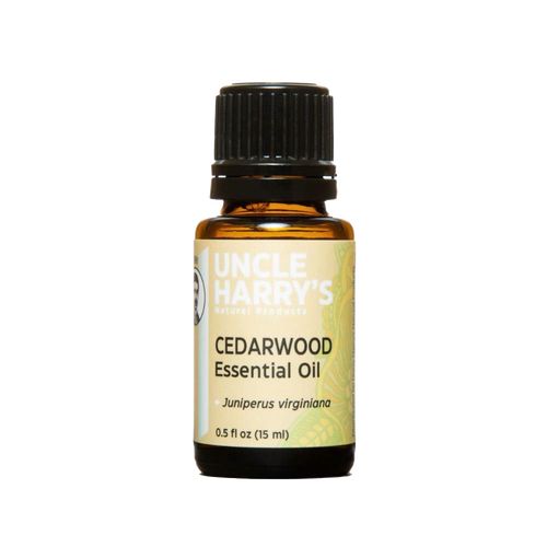 Amber glass bottle of handcrafted cedarwood essential oil with black cap and dropper, made in USA and ideal for Health & Wellness, Soapmaking, Candlemaking, and Health Remedies collections.