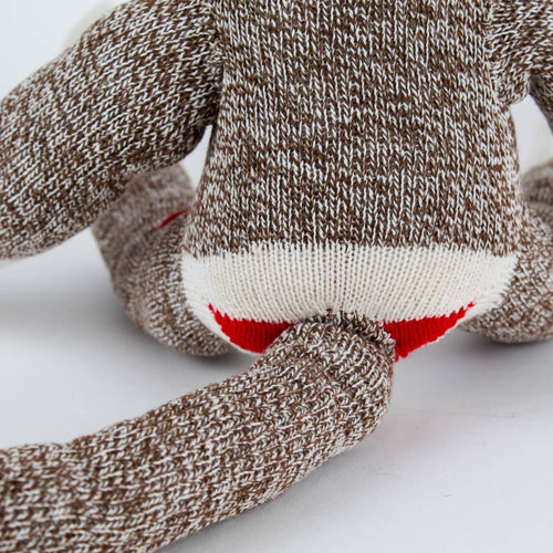 Close-up of the back of a handcrafted sock monkey made from classic red and white heel socks, showcasing the detailed knit texture and flexible tail, featured in Toys, Books & Games, USA Made, Children's Toys, Indoor Play, Best Sellers, and Promo Eligible collections.