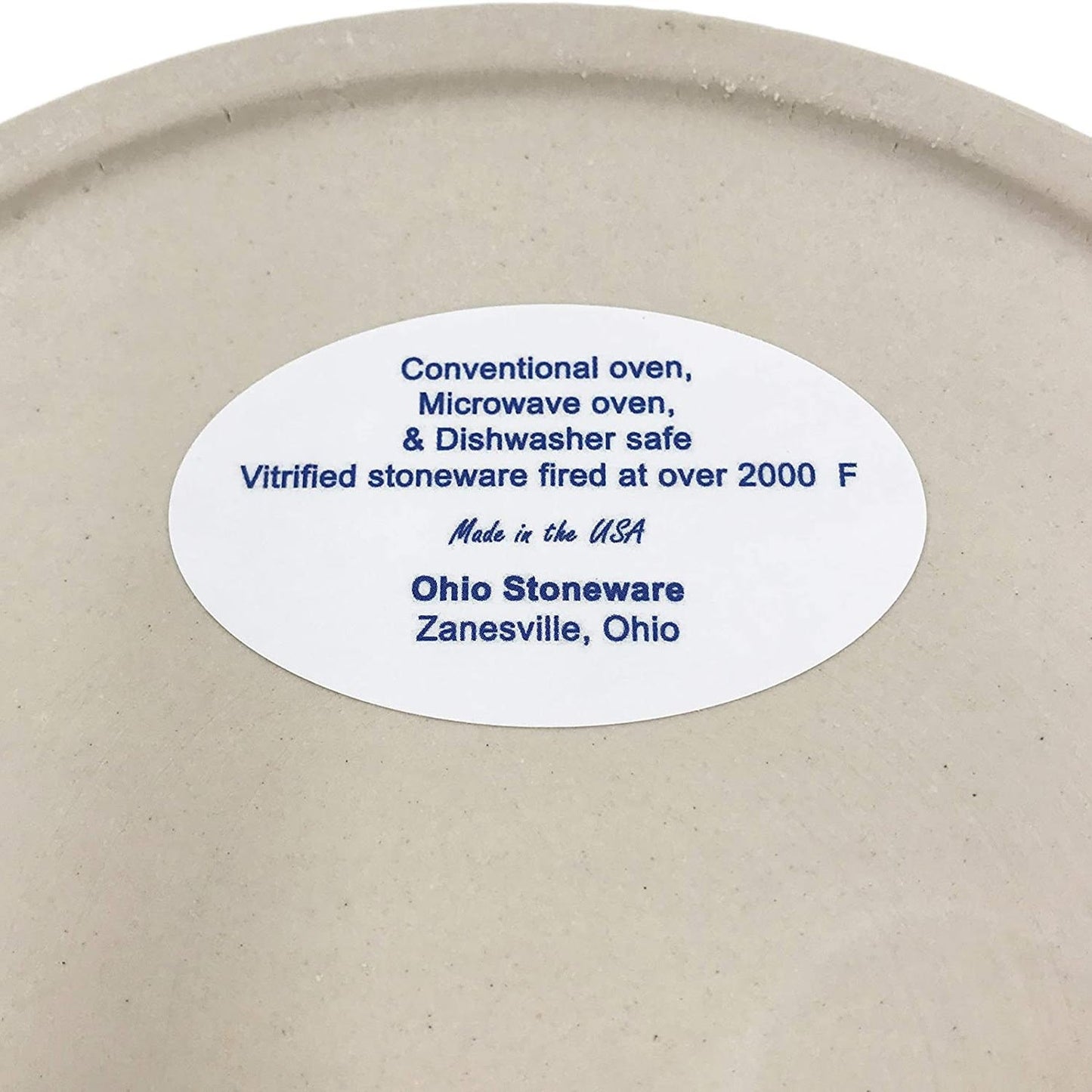 Close-up of a cream-colored stoneware crock label indicating it is safe for conventional oven, microwave, and dishwasher use, made in the USA, featured in Kitchen & Food, Food Preservation, and Best Sellers collections.
