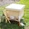 Handcrafted natural wood 8-frame beehive kit with smoker, hive tool, bee brush, and feeder jar displayed outdoors on grass, perfect for Farm, Garden & Tool and Beekeeping Supplies collections.
