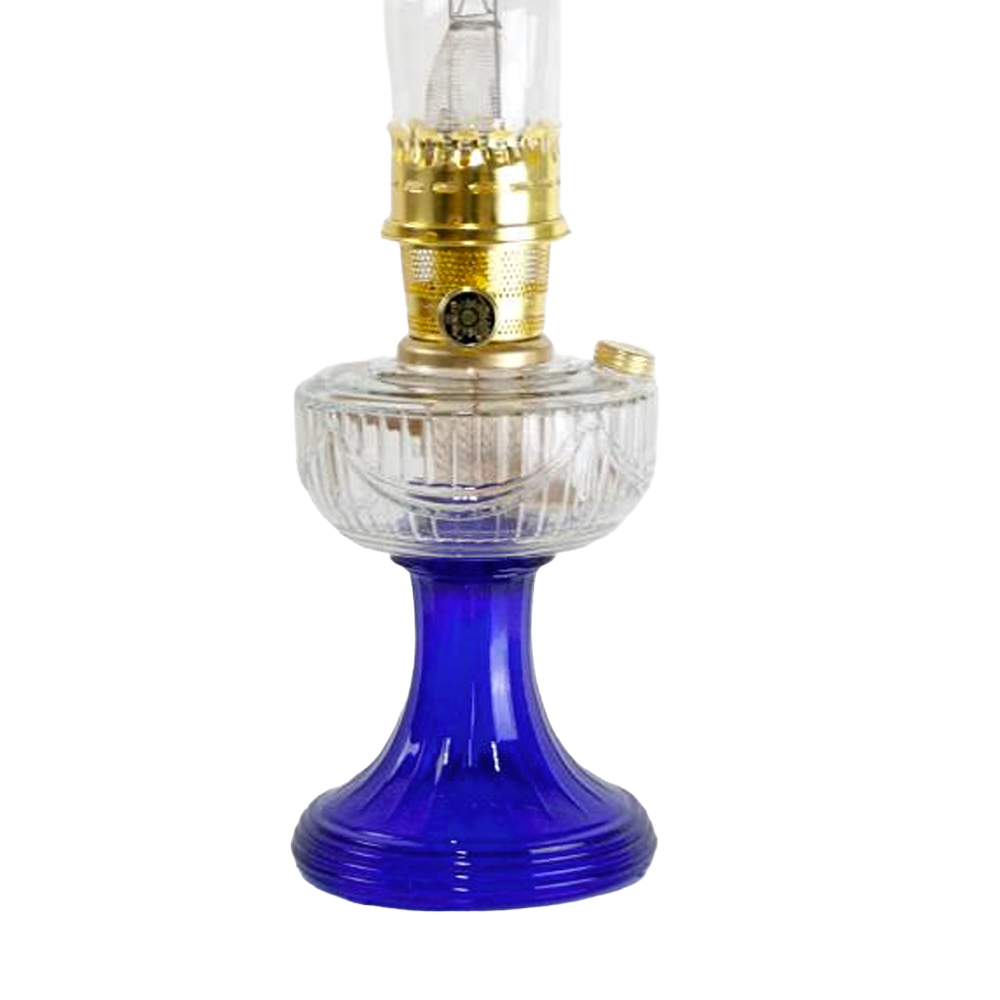 Handcrafted oil lamp featuring a clear glass font with a sweeping design and vibrant cobalt blue base, accented with brass burner, perfect for Lamps & Lighting, Oil Lamps, Table Lamps, Best Sellers, and Promo Eligible collections.