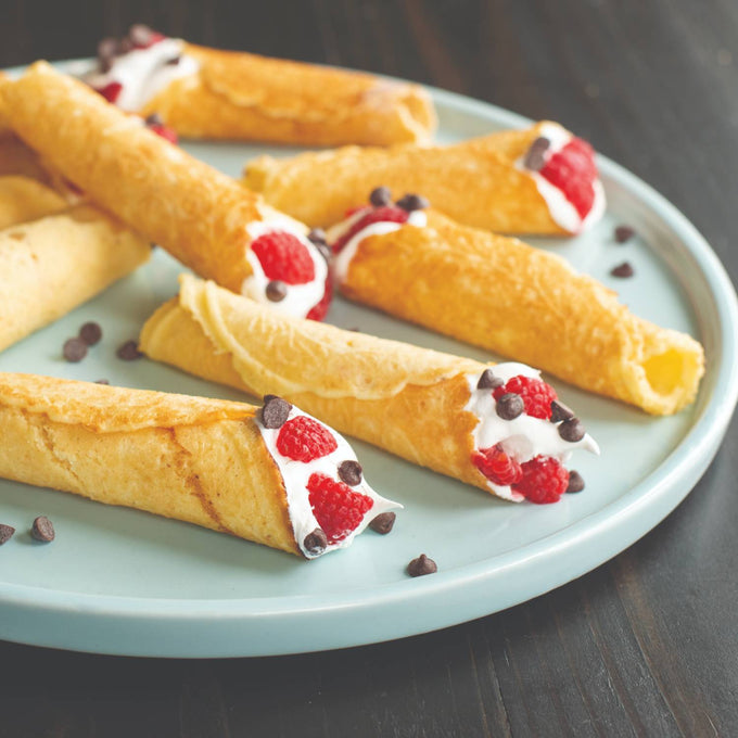 Light golden rolled cookies filled with whipped cream, fresh raspberries, and chocolate chips on a pale blue plate, featured in Kitchen & Food and Baking Supplies collections.