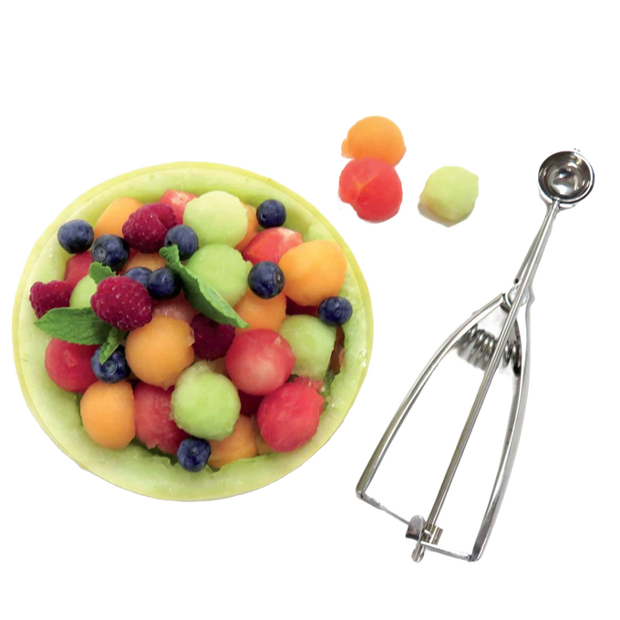 Handcrafted stainless steel scoop with spring release beside a melon bowl filled with assorted melon balls, blueberries, and raspberries, ideal for Kitchen & Food, Cookware, Baking Supplies, Kitchen Gadgets, and Best Sellers collections.